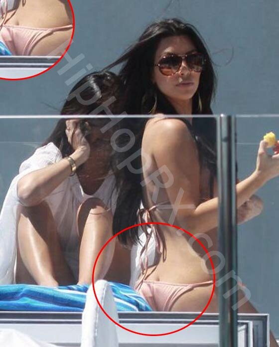Photo of Kim Kardashian in bikini on boat showing booty cleavage