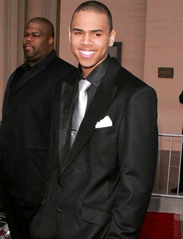 Photo of Chris Brown wearing black suit
