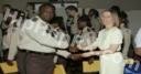Photo of Rick Ross in Correctional Officer Uniform Accepting Diploma