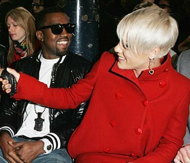 Photo of Pink sitting next to Kanye West