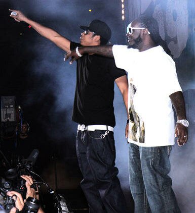Photo of T-Pain and Jay-Z on stage