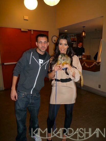 Photo of Kim Kardashian holding monkey that took a pee-pee break on her