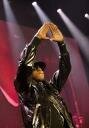 Jay-Z holding up his signature sign, close to Illuminati