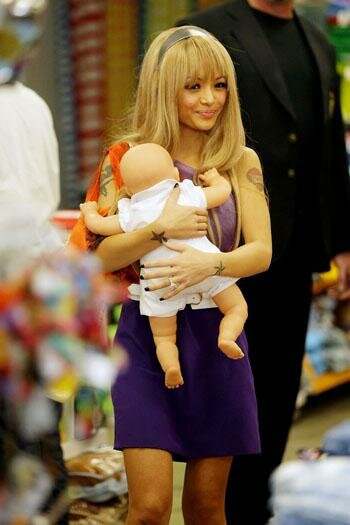 Photo of Tila Tequila and baby