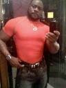 Photo of Bishop Eddie Long taking photos on his cellphone in the bathroom