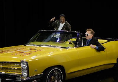 Photo of Snoop Dogg and his Yellow 1967 Pontiac Parisienne Convertible