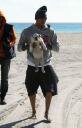 Picture of Chris Brown with Jasmine Sanders and puppy on beach, Dec 2010