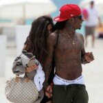 Photo of Lil Wayne on the beach with new lady