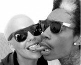 Photo of Amber Rose and Wiz Khalifa kissing with tongue
